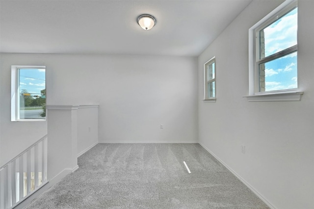 unfurnished room featuring carpet flooring