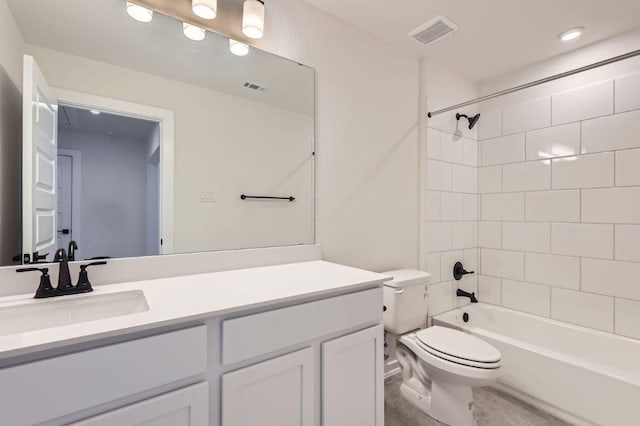 bathroom with toilet, shower / washtub combination, vanity, and visible vents