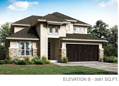 view of front of home with a front yard and a garage