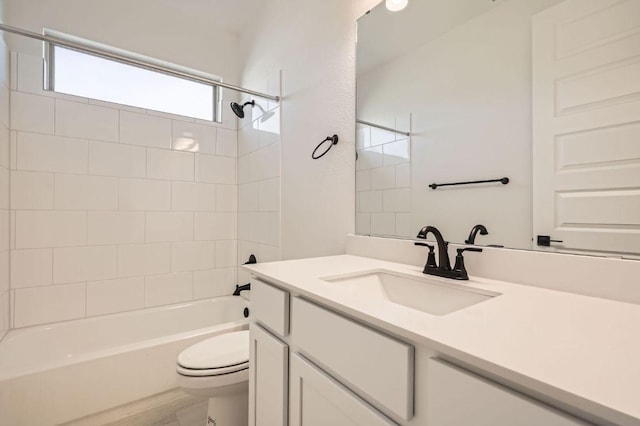 full bathroom with toilet, vanity, and shower / tub combination