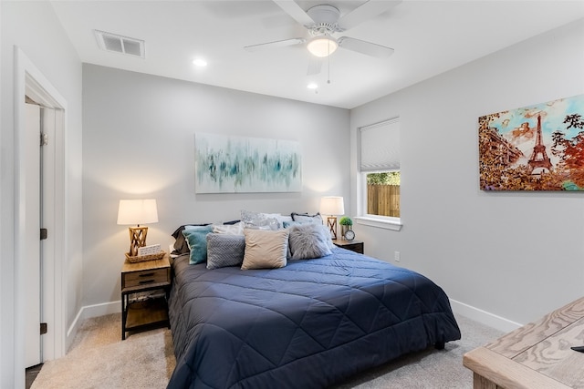 bedroom with light colored carpet and ceiling fan