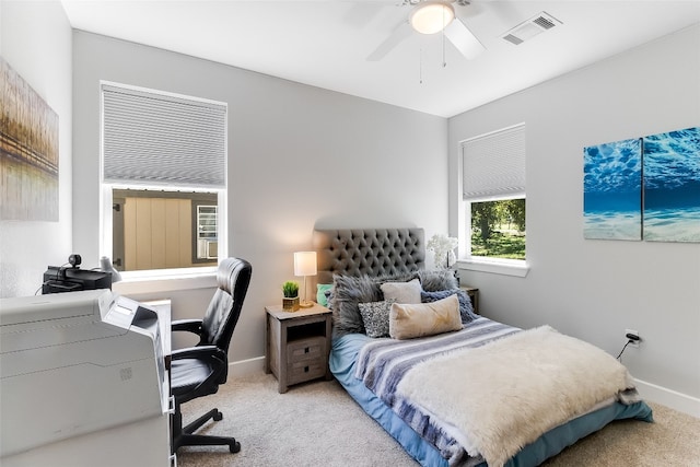 bedroom with ceiling fan and light colored carpet