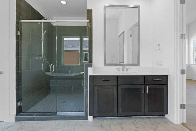 bathroom with vanity and an enclosed shower