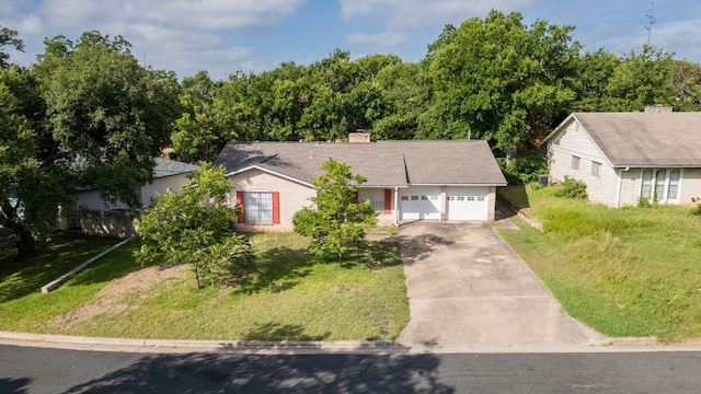 ranch-style home with a garage and a front yard