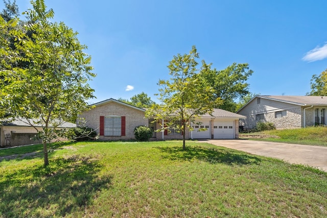 single story home featuring a garage and a front yard