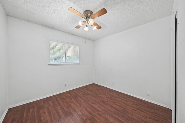 spare room with ceiling fan, hardwood / wood-style flooring, and a textured ceiling