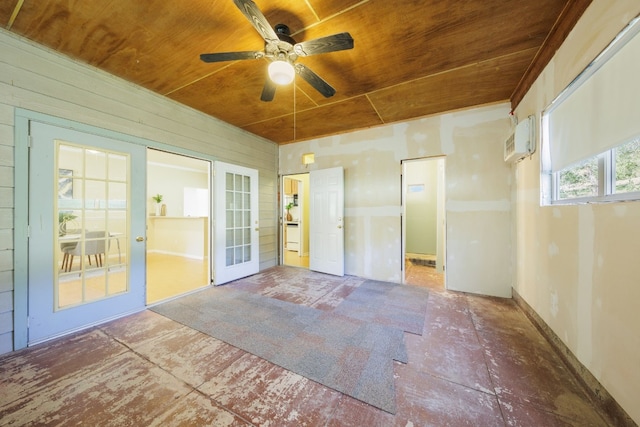 unfurnished room featuring wood ceiling, ceiling fan, and a wall unit AC