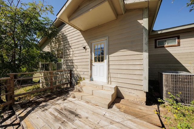 wooden deck with central air condition unit