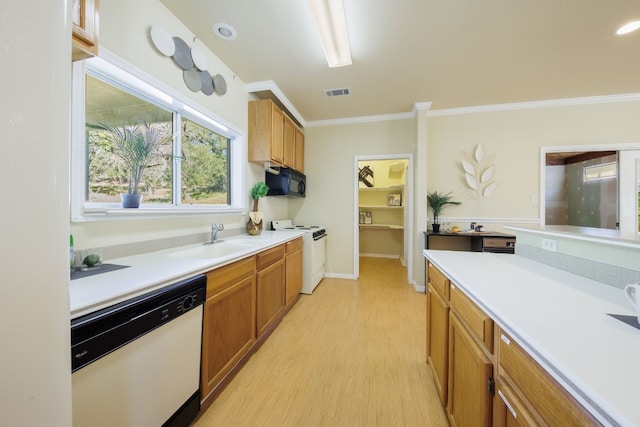 kitchen with ornamental molding, white appliances, sink, and light hardwood / wood-style floors