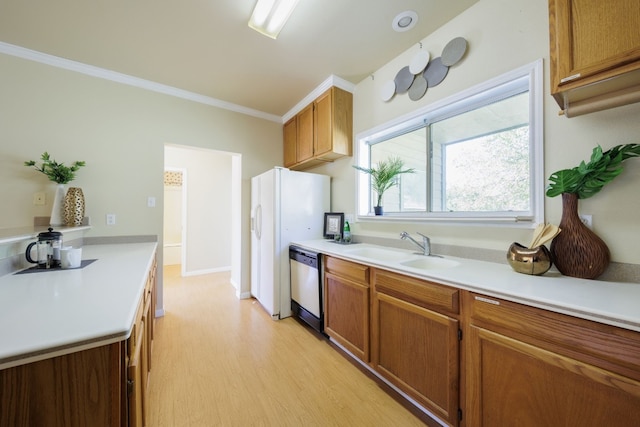 kitchen featuring crown molding, light hardwood / wood-style flooring, sink, white refrigerator, and stainless steel dishwasher