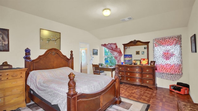 bedroom featuring dark parquet flooring and vaulted ceiling