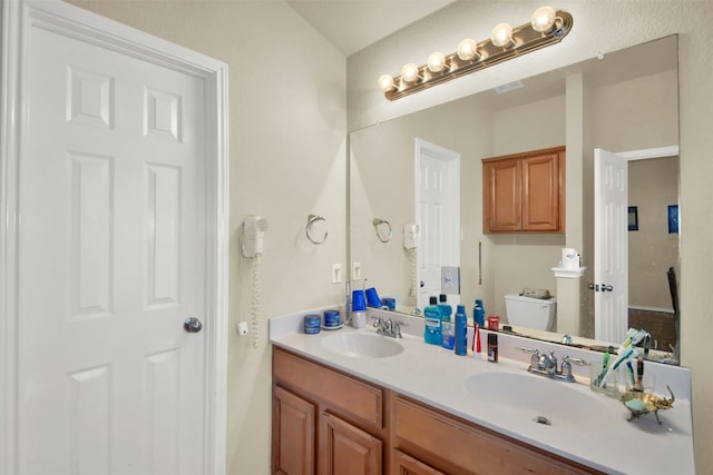 bathroom with vanity and toilet