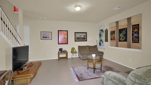 living room with tile patterned floors