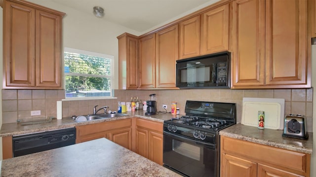 kitchen with black appliances, backsplash, and sink