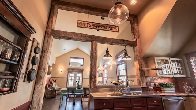 bar with hanging light fixtures, dark wood-type flooring, french doors, dark brown cabinetry, and sink