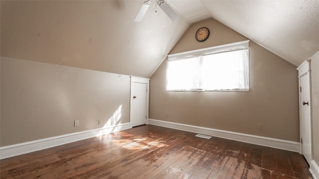 bonus room with vaulted ceiling, dark hardwood / wood-style floors, and ceiling fan