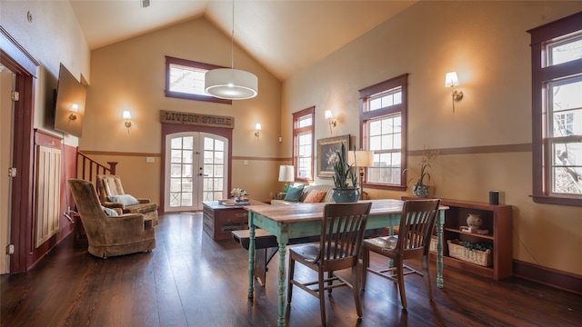 dining space with dark wood-type flooring, high vaulted ceiling, and a healthy amount of sunlight