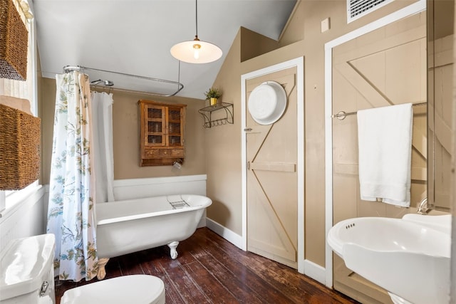 full bathroom featuring hardwood / wood-style flooring, vaulted ceiling, toilet, sink, and plus walk in shower