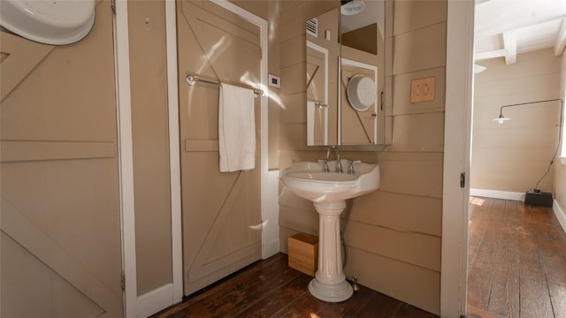 bathroom with hardwood / wood-style flooring