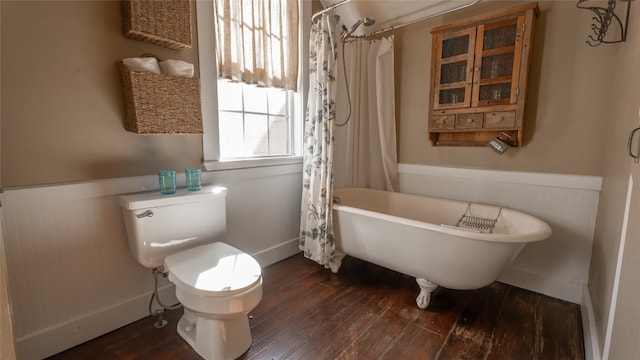 bathroom with shower / bath combination with curtain, toilet, and hardwood / wood-style flooring