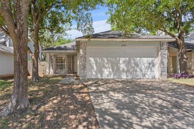 ranch-style home featuring a garage