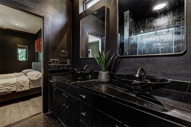 bathroom featuring ornamental molding and vanity