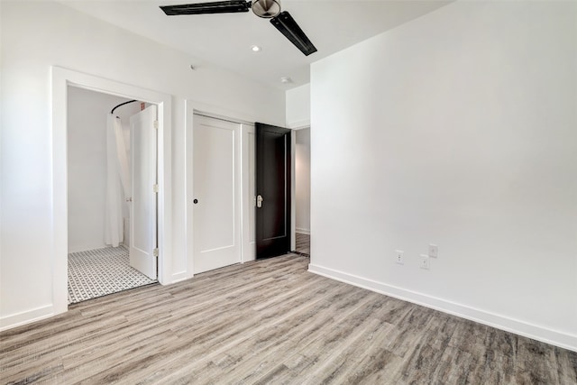 unfurnished bedroom featuring light wood-type flooring, a closet, and ceiling fan