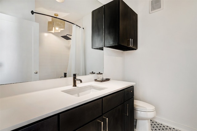 bathroom with vanity, toilet, a shower with curtain, and tile patterned flooring