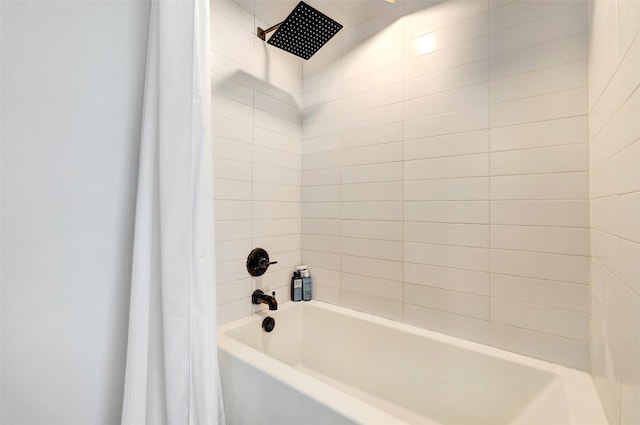 bathroom with shower / tub combo with curtain