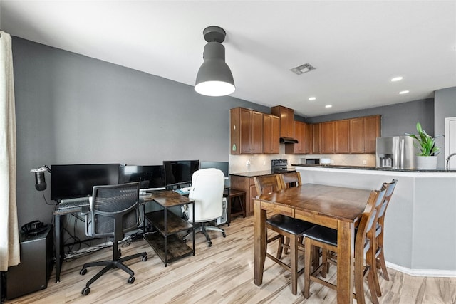 office area with light wood-type flooring