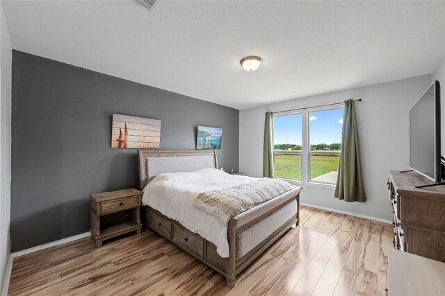 bedroom featuring light hardwood / wood-style flooring