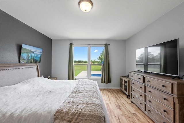 bedroom with light wood-type flooring