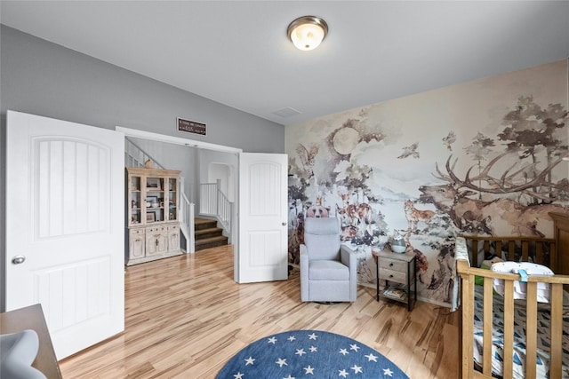 bedroom with wood-type flooring