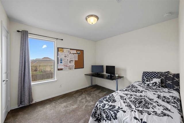 bedroom featuring dark colored carpet