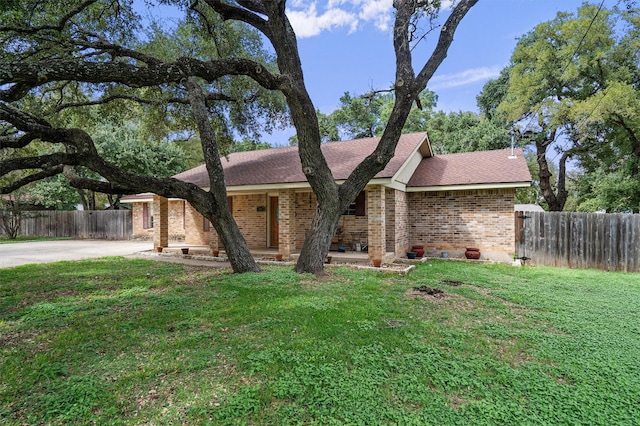 ranch-style house with a front lawn