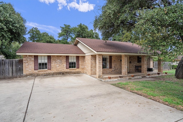 single story home with a porch