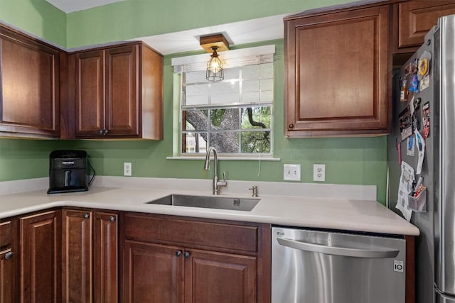 kitchen featuring stainless steel appliances and sink