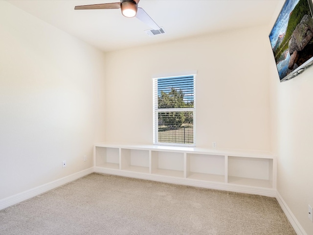 spare room with ceiling fan and carpet floors