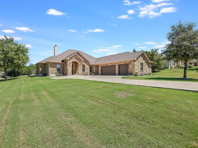 ranch-style house featuring a front lawn and a garage