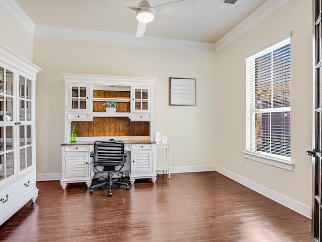 home office featuring ornamental molding, dark hardwood / wood-style flooring, ceiling fan, and built in desk