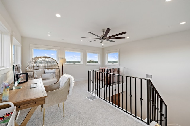 office with ceiling fan and light carpet