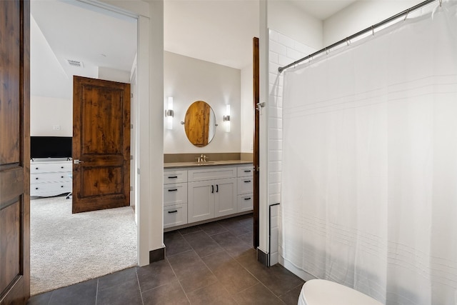 bathroom featuring vanity, toilet, a shower with shower curtain, and tile patterned flooring