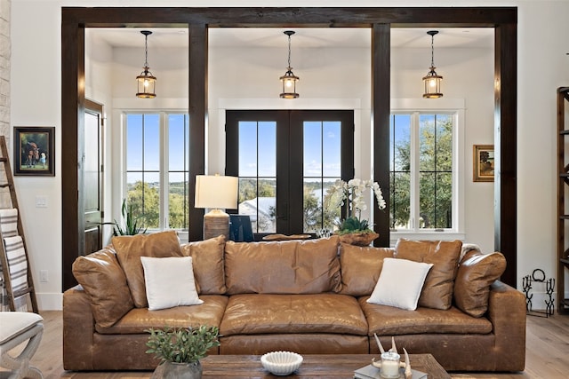 living room featuring light wood-type flooring and french doors