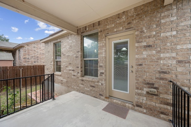 entrance to property with a patio area