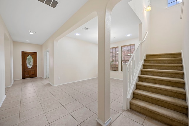 foyer with plenty of natural light and light tile patterned flooring