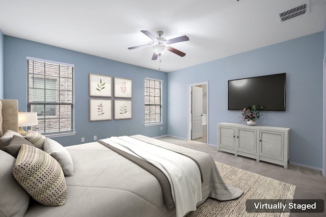 bedroom featuring ceiling fan and light colored carpet