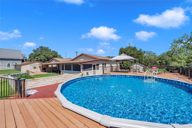 view of swimming pool with a wooden deck and a gazebo