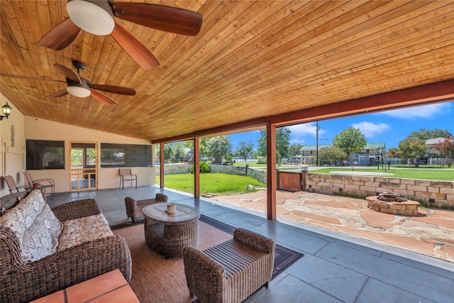 interior space with wooden ceiling, vaulted ceiling, and ceiling fan