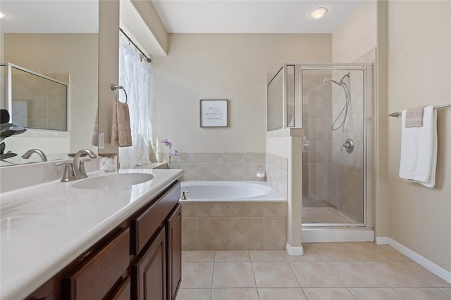 bathroom featuring vanity, separate shower and tub, and tile patterned floors