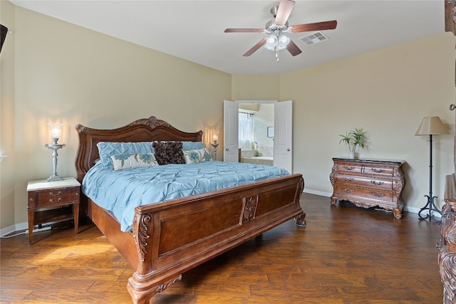 bedroom featuring hardwood / wood-style flooring, ceiling fan, and ensuite bath